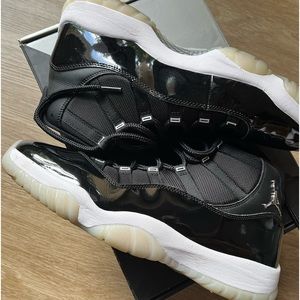 A pair of 25th Anniversary Jordan 11s size 11. This shoe has been worn twice.
